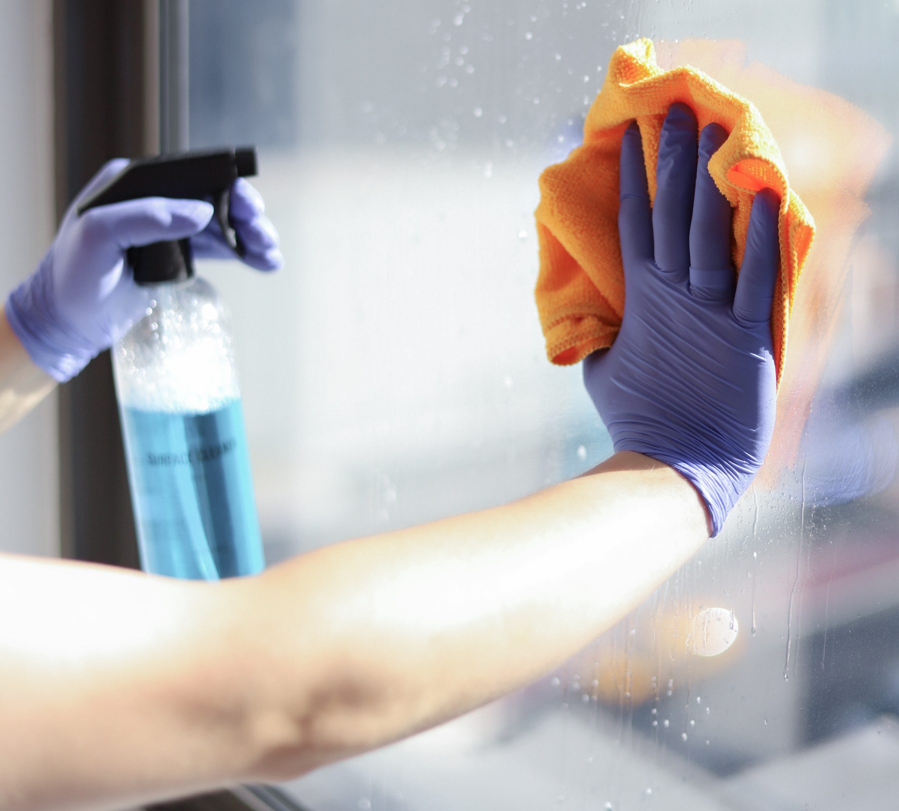 Gloved Cleaning Master professional disinfecting glass with spray and microfiber cloth