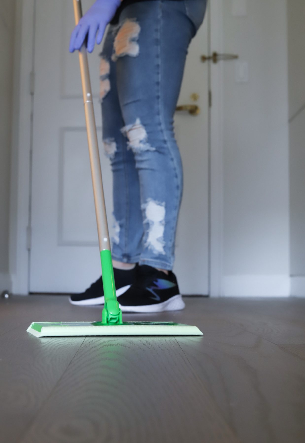 Cleaning Master professional mopping the floor during a move-out cleaning