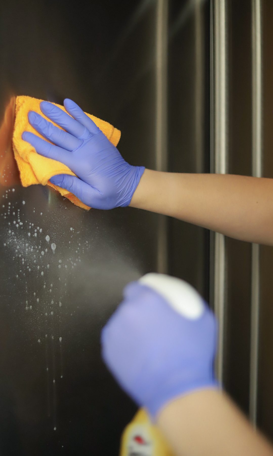 Cleaning Master professional polishing a stainless steel surface to a streak-free finish